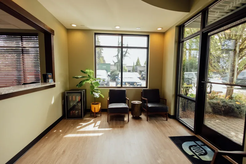 Bright, residential-style waiting area inside Asymmetric Health