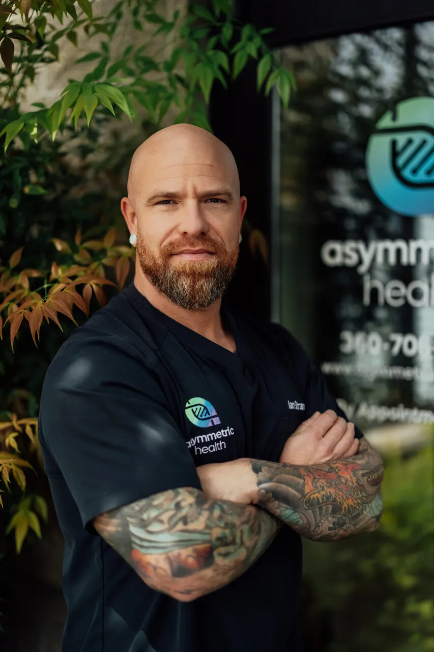 Dr. Ian Strand, DO outside the Asymmetric Health clinic in Lacey, WA