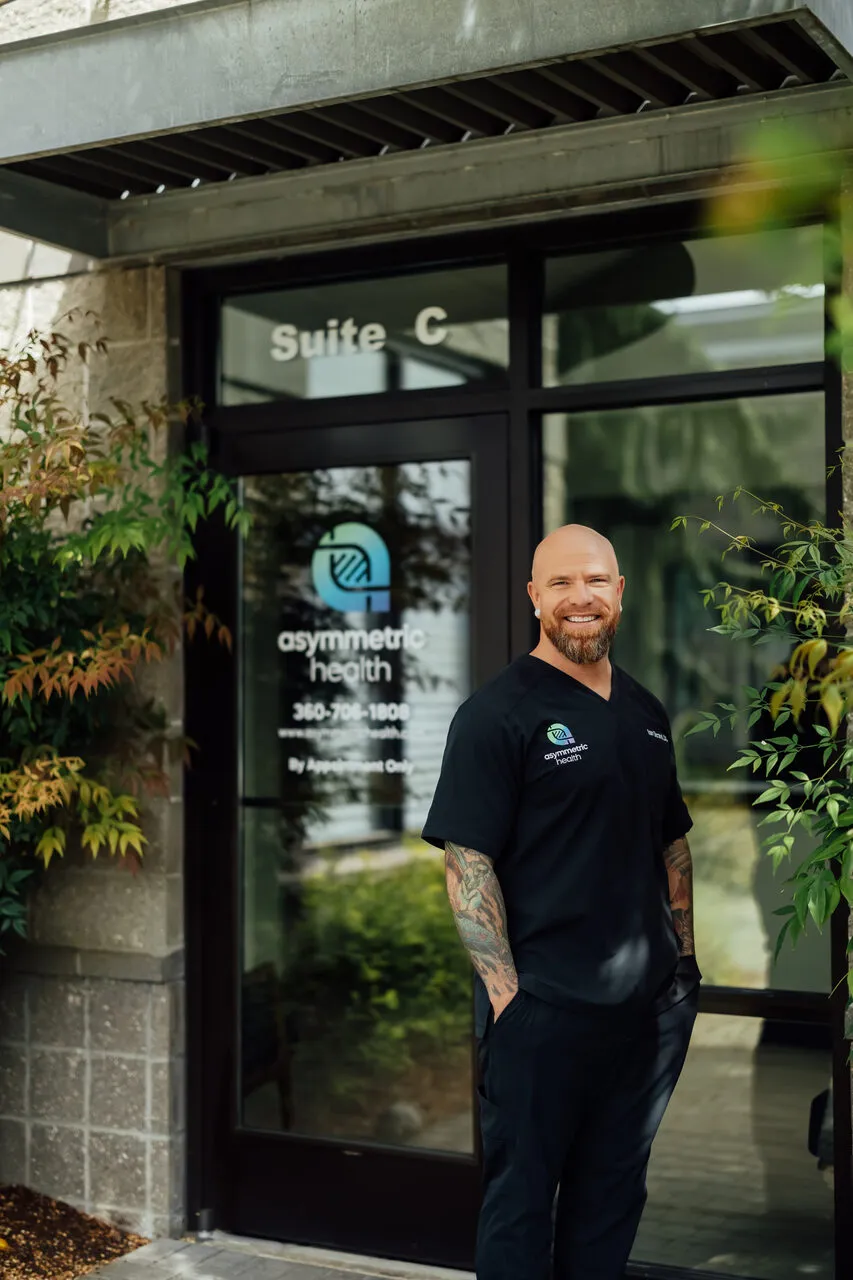 Dr. Ian Strand outside the Asymmetric Health clinic Suite C in Lacey, WA, serving Olympia patients