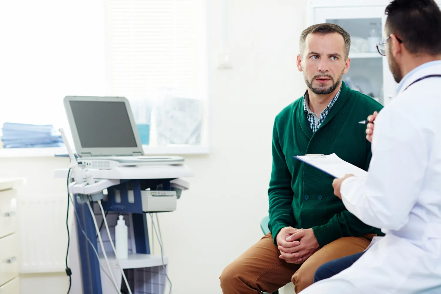 Doctor reviewing hormone lab results with patient