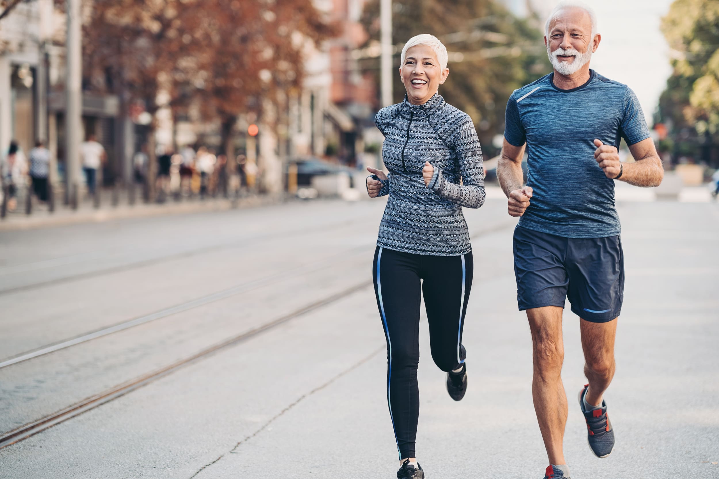 iStock-1284970958-scaled senior couple running